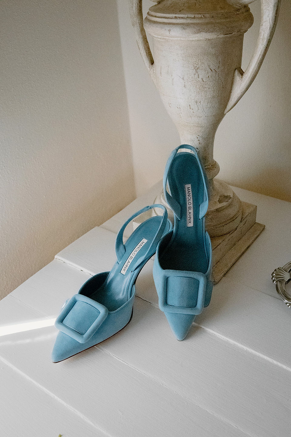Manolo Blahnik wedding shoes in soft natural light at Conti di San Bonifacio Tuscany, luxury bridal details from an elegant Italian destination wedding