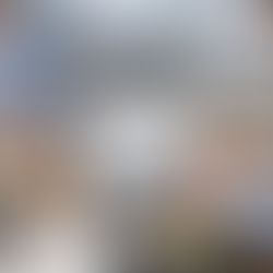 Two people in an office analyze finances on a laptop. Charts, papers, and a calculator show $1,250. Mood is focused and collaborative.