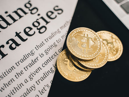 Gold Bitcoin coins on a newspaper about trading strategies, with a sleek black background and a finance-focused mood