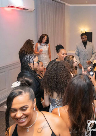 A stylish group of guests dance and laugh together at a modern 40th birthday party in Worcestershire. Fun, candid party photography by SGS Photography.
