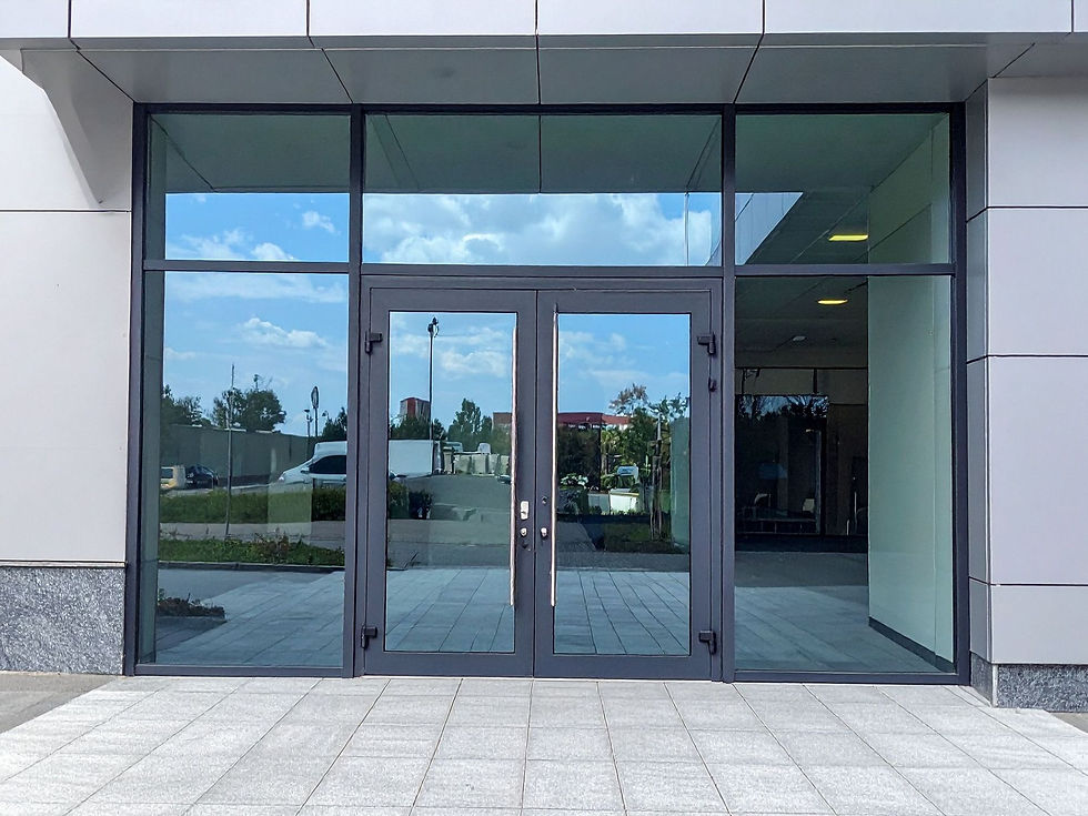 New commercial glass doors being installed at retail property