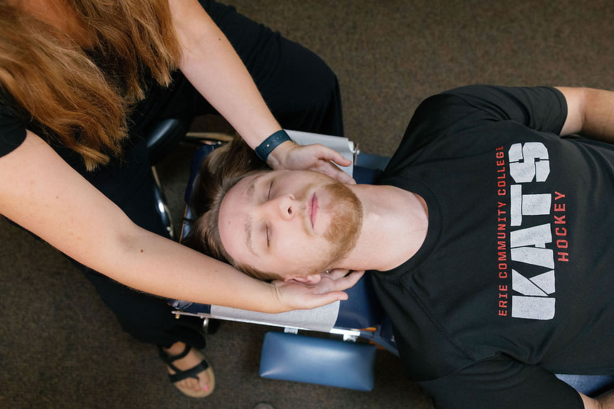 Chiropractor Dr. Ball performing a gentle face-up adjustment at 716 Chiropractic & Wellnes