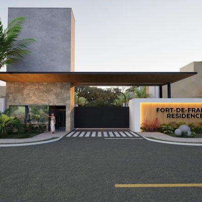 Entrada principal do condomínio Fort-de-France Residence no Araçagy em São José de Ribamar, com fachada moderna e paisagismo tropical.