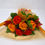 Thumbnail: Six Orange Roses with Maple Leaves