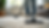 Close-up view of a professional cleaner vacuuming a carpet in a bright living room