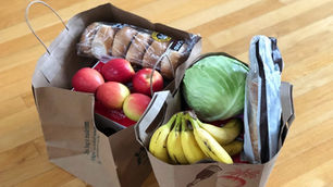 uni food shopping list essentials - apples, bread, bananas in brown bags