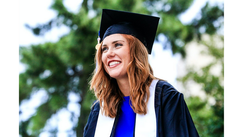 Female graduating. free masters degree uk article