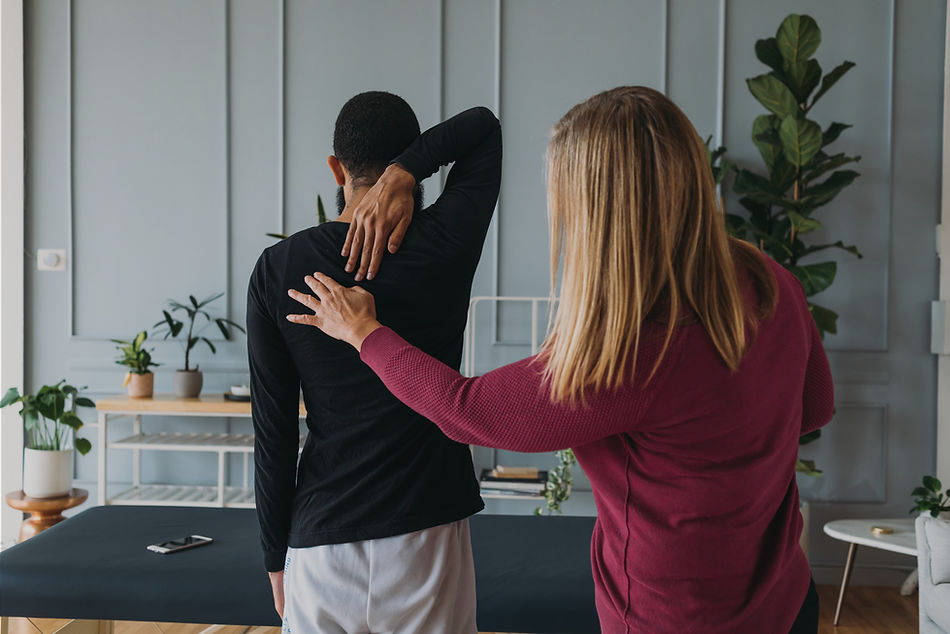 SFMA Australia practitioner assessing a patient's shoulder movement