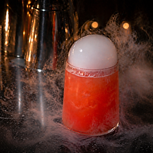 Cocktail with smoke effect and dramatic presentation at an event bar