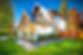 Colorful house with peak roof large windows in autumn fall sunny blue sky and vivid landsc