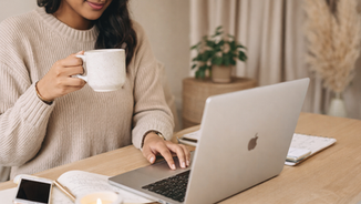 Woman working on her personal brand on her laptop