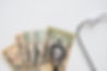 overhead-view-stethoscope-us-currency-note-white-background.jpg