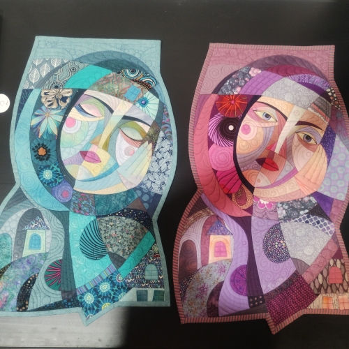 Applique mini quilts depicting two dreaming women, one asleep and one awake
