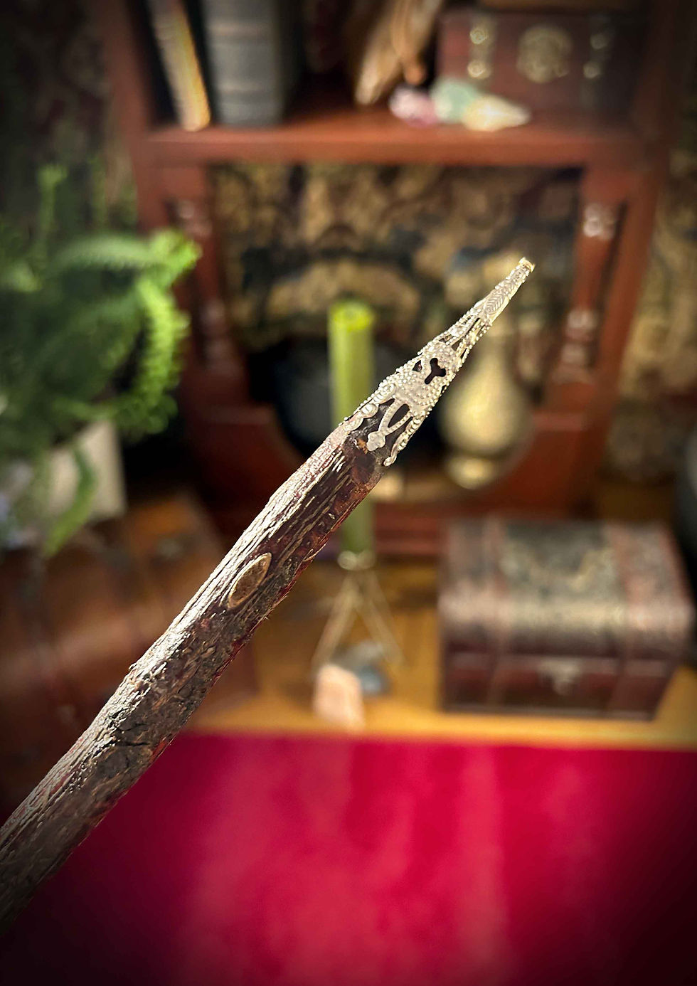 Thumbnail: Wooden wand with pointed tip against a blurred mystical background.