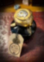 Thumbnail: Gold skull sculpture "ASK ME ABOUT THE DEAD" tag. Handmade Brass Arcanum Decoration.