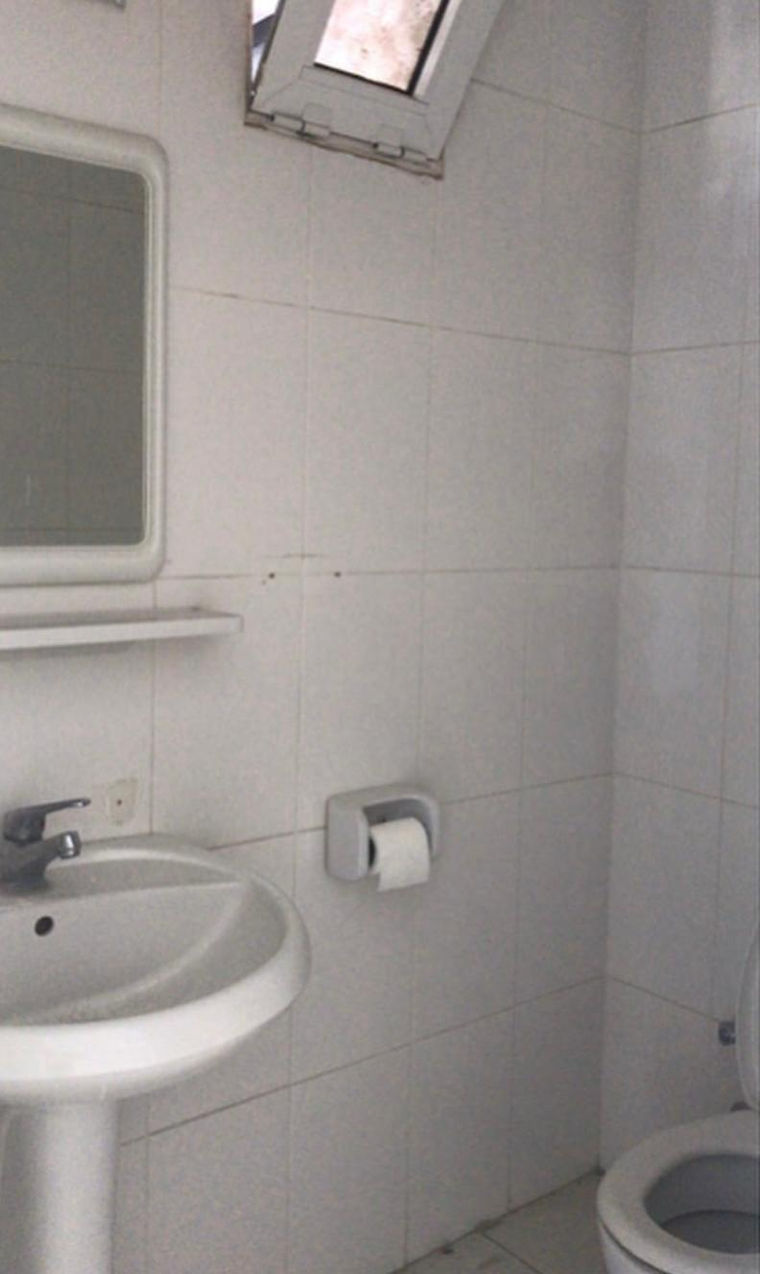 Bold Red and White Bathroom Renovation Featuring Marble Effect Tiles, Brass Finishes and Bespoke Interior Design