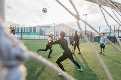 Goalie-catching-ball-in-game-of-football