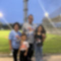 Family at baseball game wearing custom athlete shirts and tank top