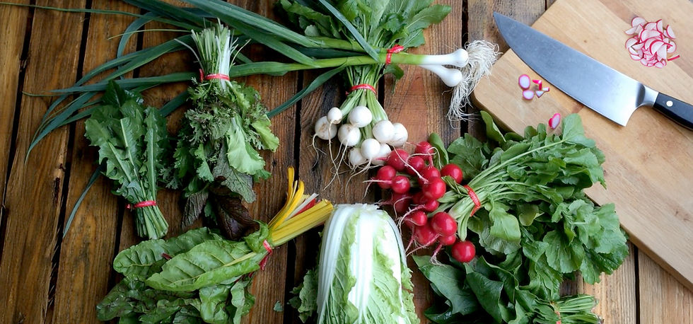 White Barn Farm's Seasonal vegetables on a wood table