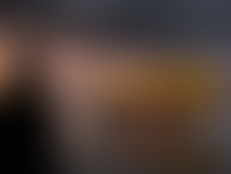 Pilot watches yellow Airbus A320 on wet tarmac at sunset. Dark storm clouds loom; raindrops on window enhance dramatic scene.From Gemini AI