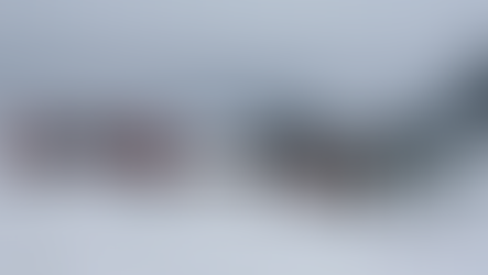 Emergency crews in orange and camouflage assess a crashed plane on icy terrain. Red fire trucks with blue lights are in the snowy landscape. From Gemini AI