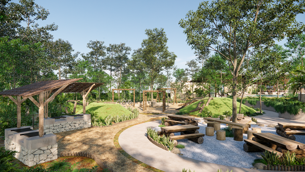 Área de picnic con mesas y bancas rodeadas de naturaleza en Emana Tulum