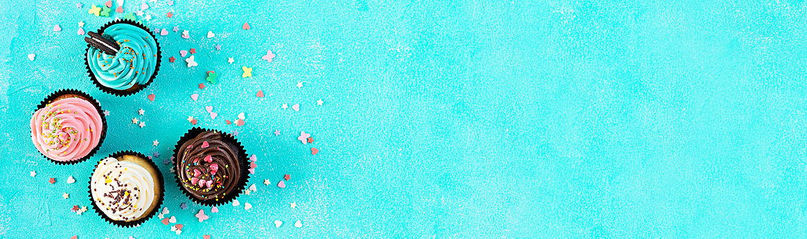 vecteezy_tasty-colorful-cupcakes-isolated-on-blue-background_8080591_597.jpg