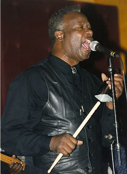 Lester Singing and playing Bell.jpg