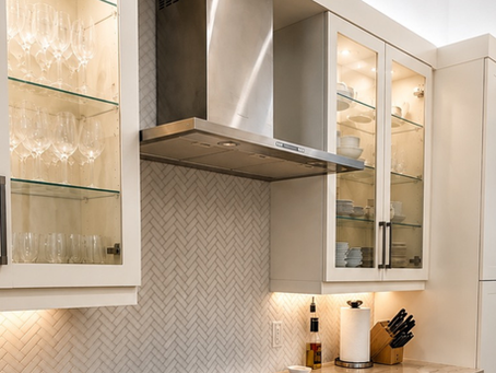 When designing a custom kitchen, it's often the smallest details that make the biggest impact. While solid cabinet doors offer clean lines and generous storage, incorporating a few glass-front cabinet doors can instantly elevate the entire space, adding elegance, depth, and personality.