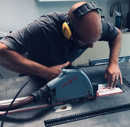 Terlecki cutting and installing a hob in kitchen