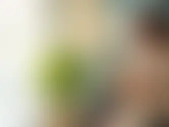 A woman holding a cup.