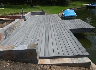 Spacious waterfront deck construction in The Woodlands, Texas, with lakeside boat access, built by Decks on The Water.