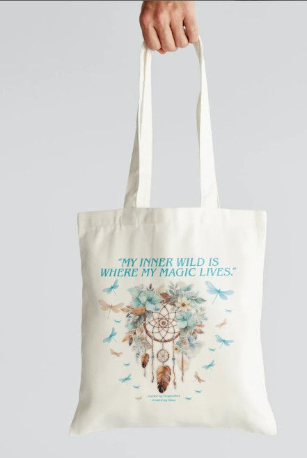 Eye-level view of a sage green tote bag with sacred geometry patterns