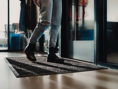 A person walking on a floor mat