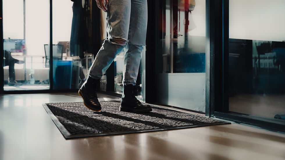 A person walking on a floor mat