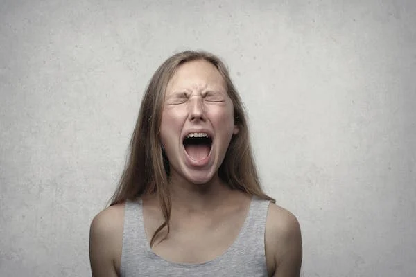 A woman using vocal release to manage her anger