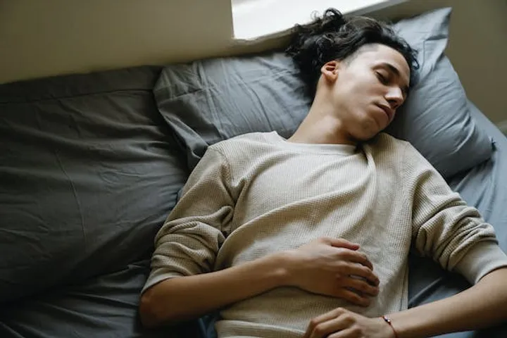 Man relaxing on the bed