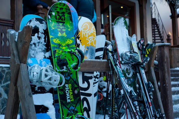 Pairs of skis leaning against a wall