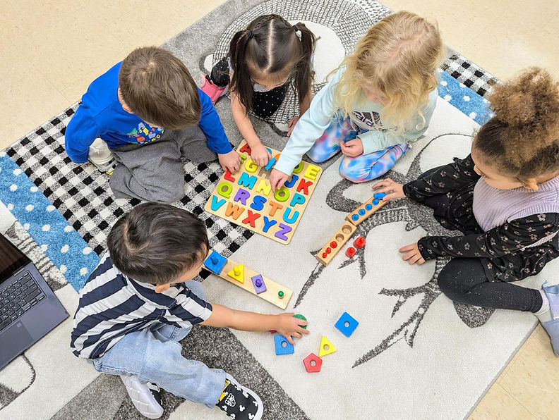 All kids on the circle mat.jpg