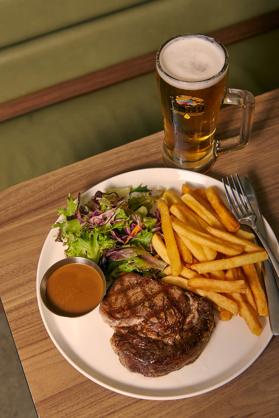 Porterhouse steak, house fries and a tossed salad