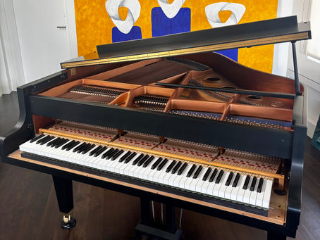 Expert piano cleaning and fire damage restoration in Los Angeles: restoring a smoke-damaged instrument to its original luster.