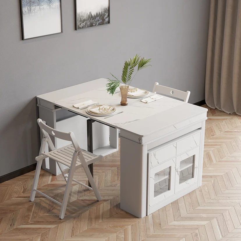 white extendable dining table in folded state with sideboard