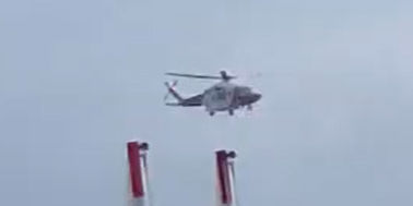 The helicopter in the sky.