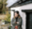 woman standing near barn building