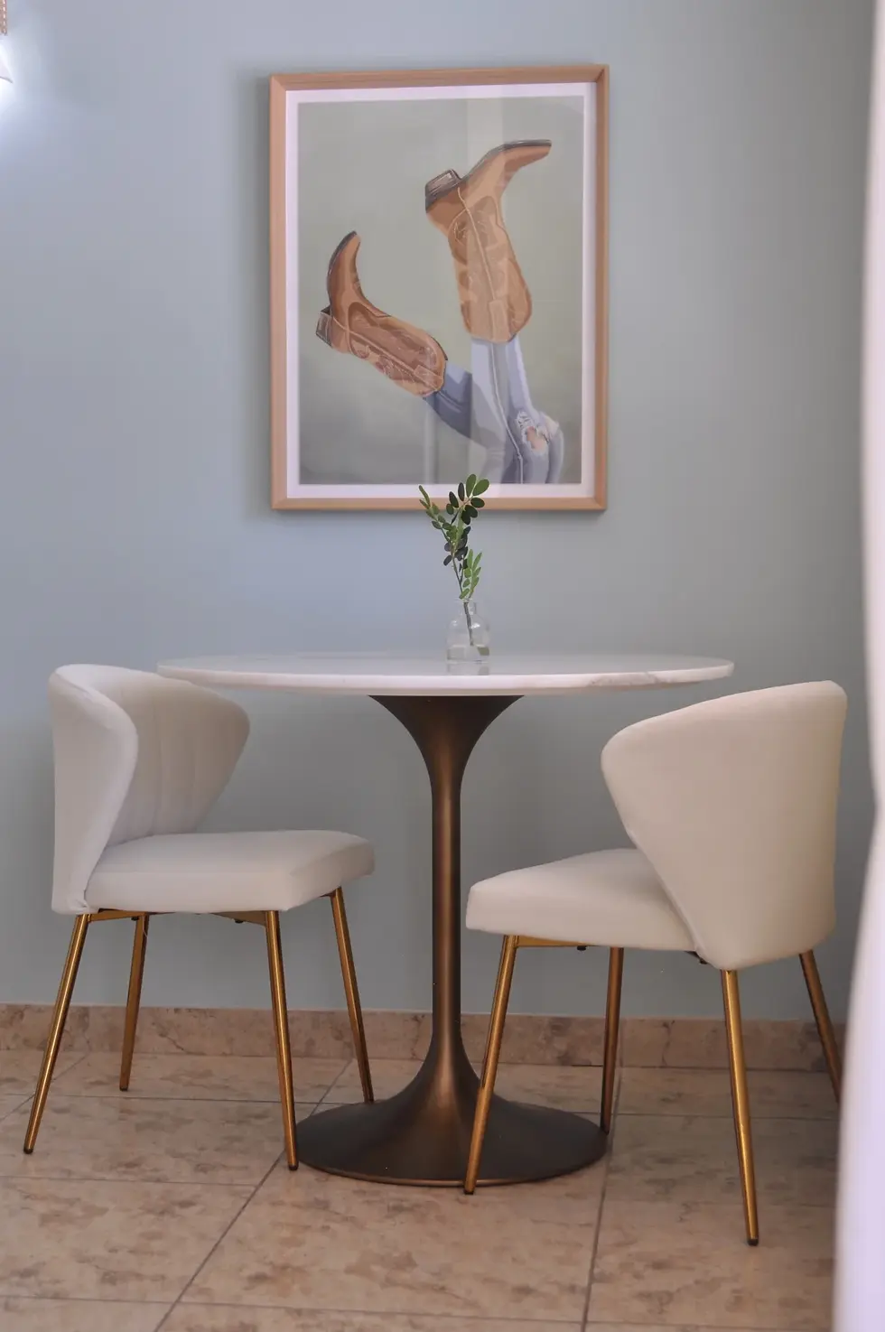 Modern seating nook with round pedestal table and curved chairs at dog friendly Palm Springs downtown property