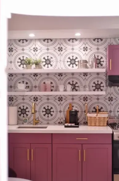Accessible bathroom vanity with burgundy cabinets and Art Deco tile in Palm Springs vacation rental