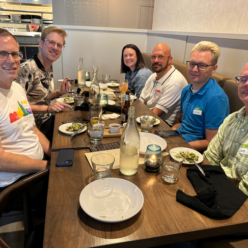 People connecting at Queer Dinner Club