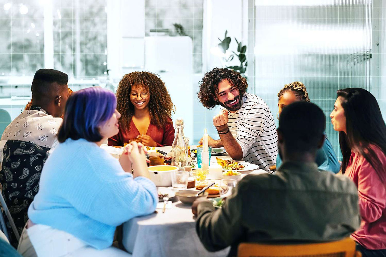 4 people connecting over dinner