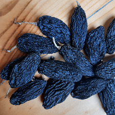 Premium Afghan black raisins with a deep natural sweetness, rich color, and soft chewy texture.