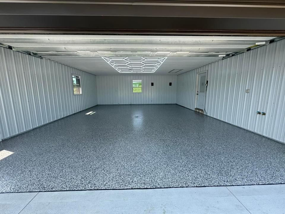 Epoxy flake garage floor with a seamless, slip-resistant finish, transforming a concrete garage into a clean, durable finished space by Durafloor.